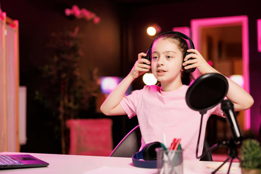 "Young girl in headphones participating in a Kids Voice Over Confidence Course | VOISA Training for Kids, learning to boost her confidence."